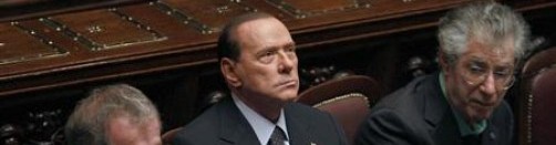Italian Prime Minister Berlusconi looks on next Justice Minister Maroni and League North Party leader Bossi during a finance vote at the parliament in Rome