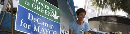 Tucson Mayoral candidate Mary DeCamp sits outside her tent at Occupy Tucson